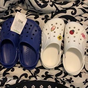 Blue Crocs and white Crocs